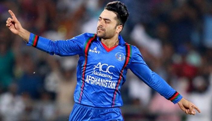 Rashid Khan celebrates after taking a wicket. Photo: AFP