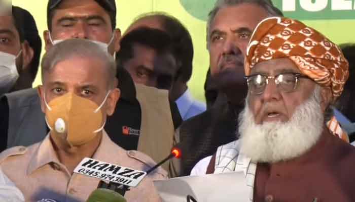 JUI-F and PDM chief Maulana Fazlur Rehman (right) along with Opposition Leader in the National Assembly and PML-N Shahbaz Sharif (left) address a press conference in Islamabad, on August 11, 2021. — YouTube