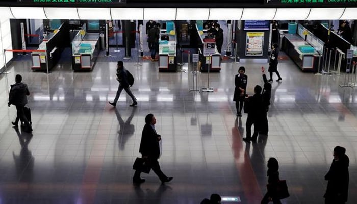 Passengers are seen in front of security check at the Tokyo International Airport, commonly known as Haneda Airport, in Tokyo, Japan January 10, 2018. — Reuters/File