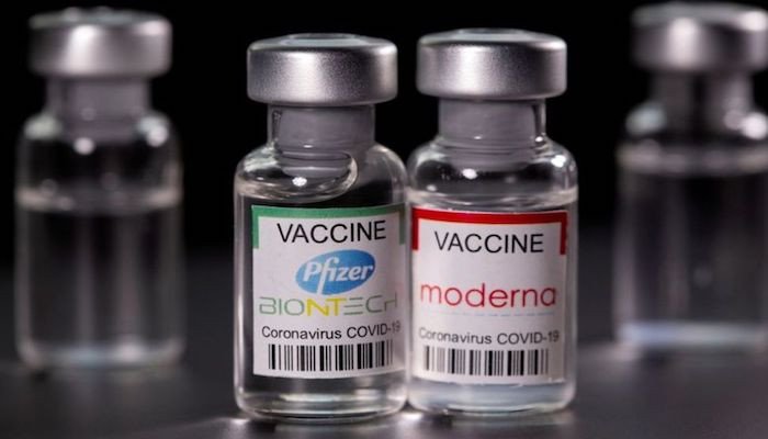 Vials with Pfizer-BioNTech and Moderna coronavirus disease (COVID-19) vaccine labels are seen in this illustration picture taken on March 19, 2021. Photo: Reuters.