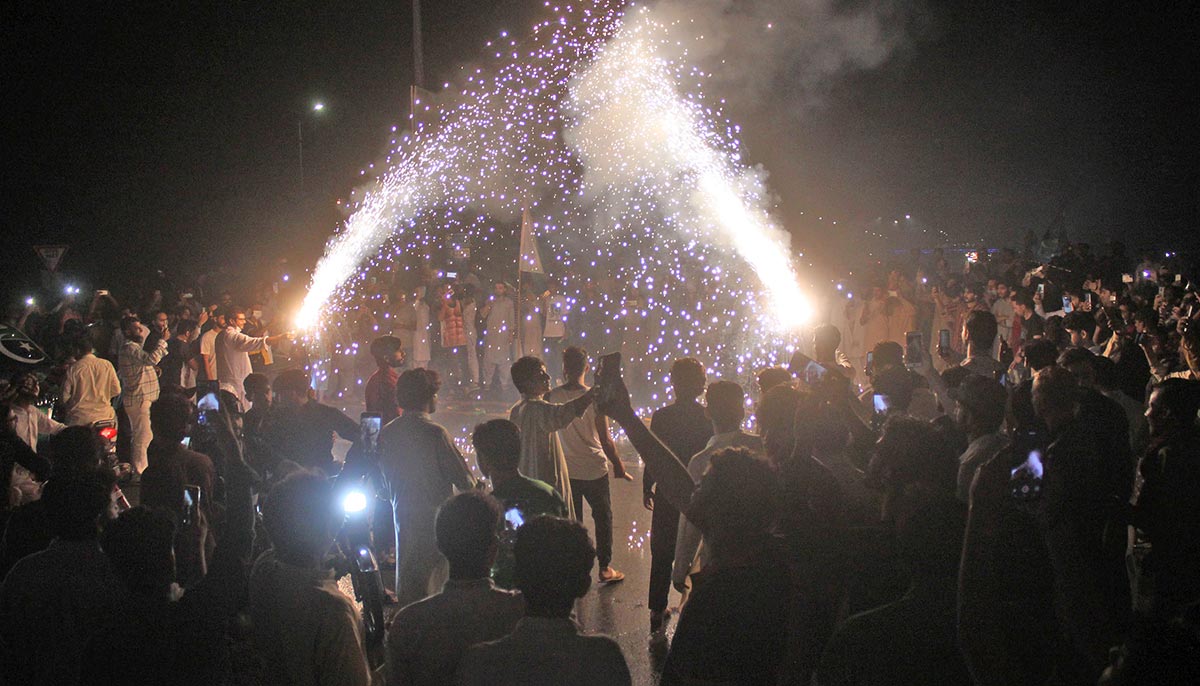 A large number of people can be seen enjoying fireworks at midnight as they celebrate Independence Day in Islamabad, on August 14, 2021. — Online