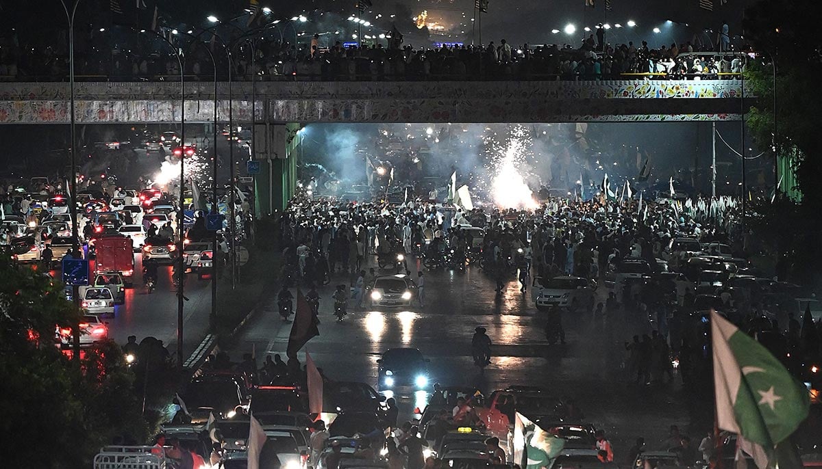 Pakistanis parade in the street during Independence Day celebrations in Islamabad on August 13, 2021. — AFP