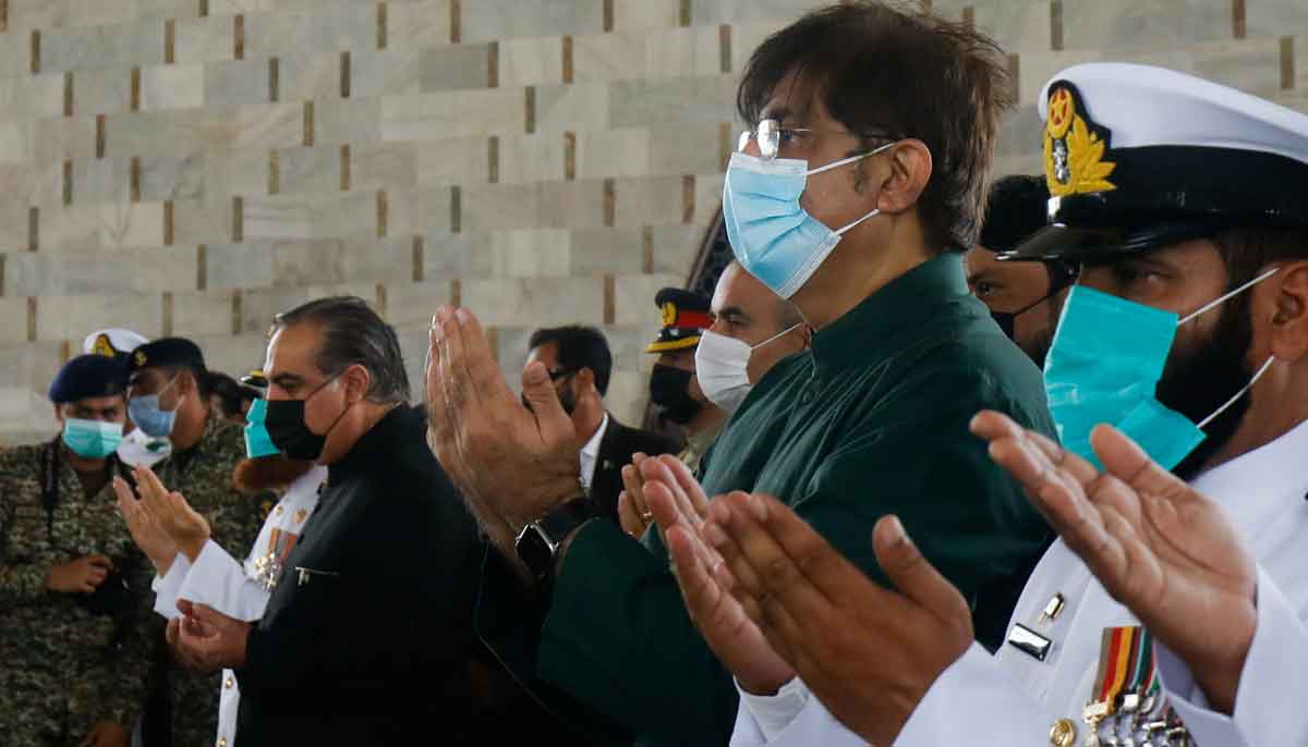 Chief Minister of Sindh, Syed Murad Ali Shah and Governor Imran Ismail, pray after laying wreaths at the mausoleum of Pakistans founder, Quaid-e-Azam Mohammad Ali Jinnah, during a ceremony to celebrate Independence Day, in Karachi, Pakistan August 14, 2021. — Reuters/Akhtar Soomro