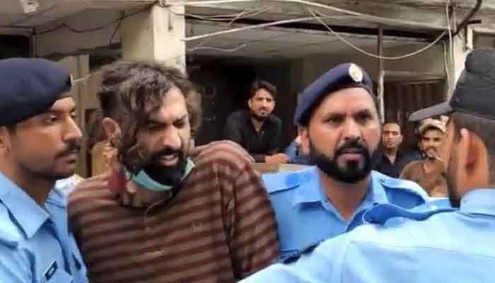 A picture of Zahir Jaffer being brought to court by policemen. Photo: File