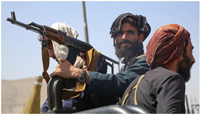 Taliban fighters stand guard in a vehicle along the roadside in Kabul on August 16, 2021, after a stunningly swift end to Afghanistans 20-year war. — AFP