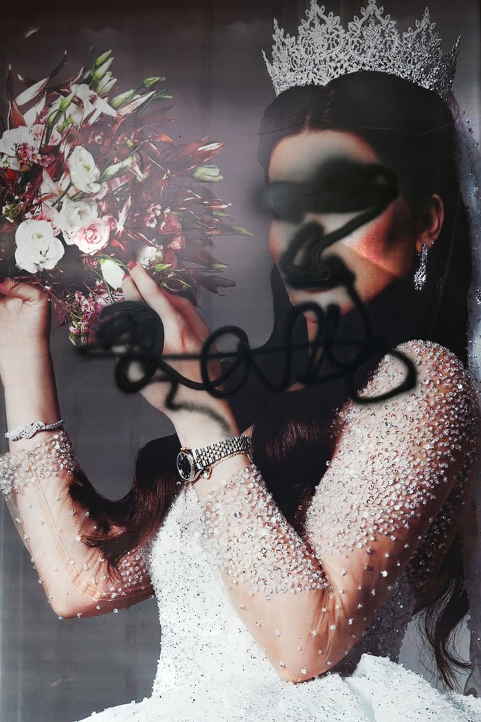 The facade of a beauty saloon is pictured with images of women defaced using a spray paint in Shar-e-Naw in Kabul on August 18, 2021. — AFP/File