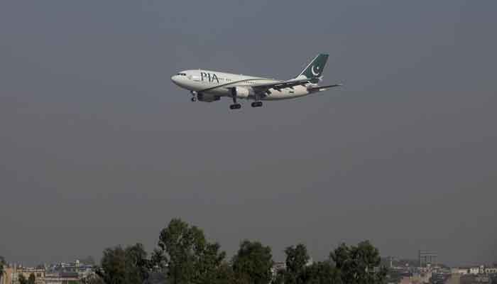 A Pakistan International Airlines (PIA) passenger plane arrives at the Benazir International airport in Islamabad, Pakistan, on December 2, 2015. — Reuters/Faisal Mahmood/File photo