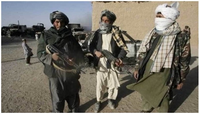 Armed Taliban fighters standing in a neighbourhood. — Photo by AFP