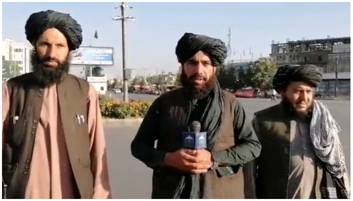 A man holds a wireless microphone as he speaks on the street in Kabul, Afghanistan in this image taken from a social media video uploaded on August 16, 2021 — Reuters.
