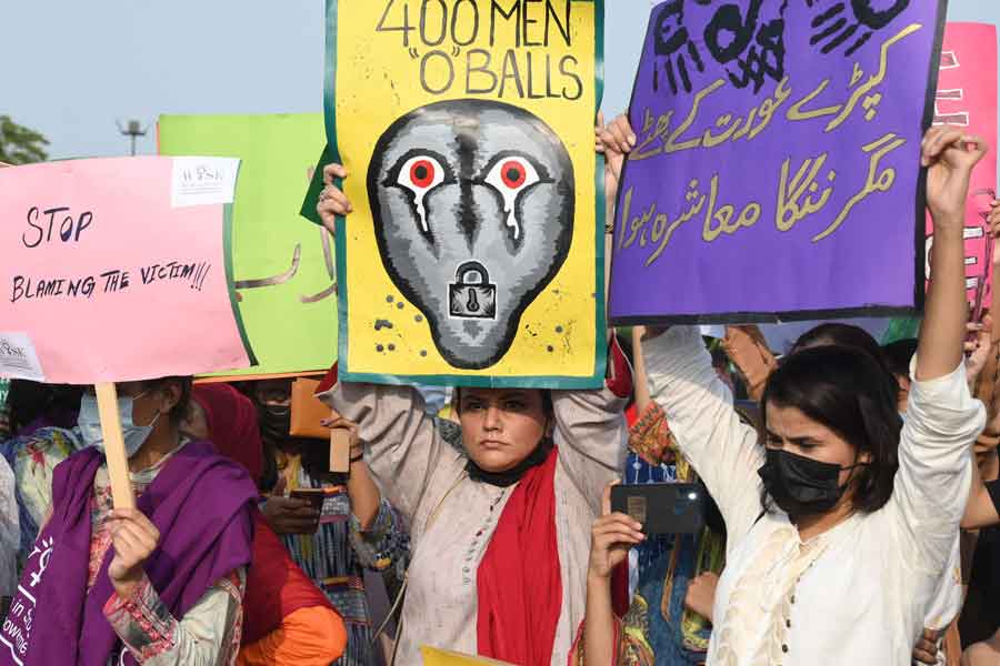 Human rights activists take part in a protest against the assault on a female TikToker by men in a public park on the eve of Pakistan´s Independence Day, in Lahore on August 21, 2021. — Photo by Arif Ali/AFP