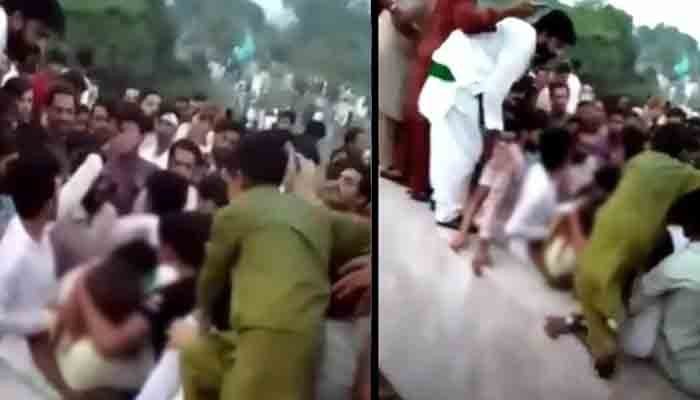 A screengrab of the viral video in which hundreds can be seen manhandling a woman at Minar-e-Pakistan. Photo: Twitter