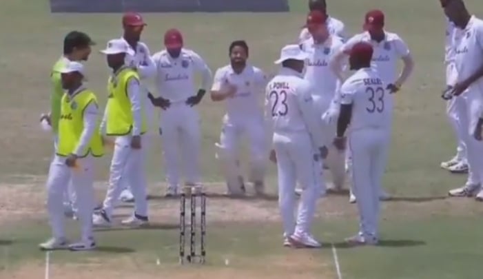 Mohammad Rizwan imitates a bowlers run up as the West Indian fielders look on. Photo: Twitter