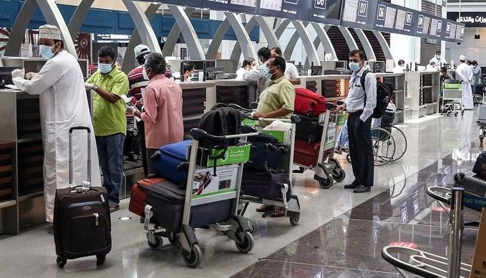 Passengers undergo routine checks to get their boarding passes at the Muscat International Airport. Photo: AFP