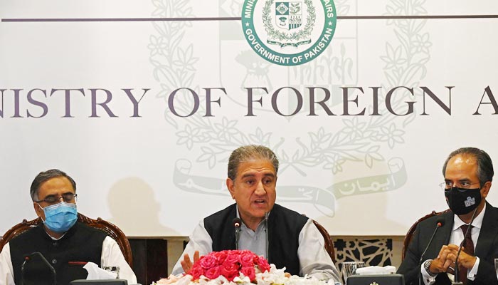 Foreign Minister Shah Mahmood Qureshi (C) speaks during a press conference over the ongoing situation in Afghanistan, at the foreign ministry in Islamabad on August 23, 2021. — AFP