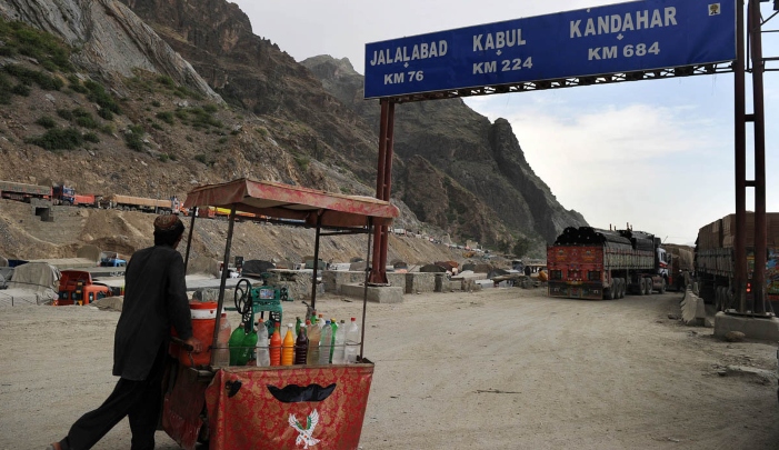 An Afghan trader pushes a drinks cart along the Torkham border. AFP