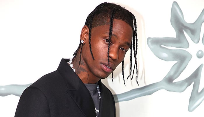 Travis Scott smiling from ear-to-ear after Kylie Jenners pregnancy reveal