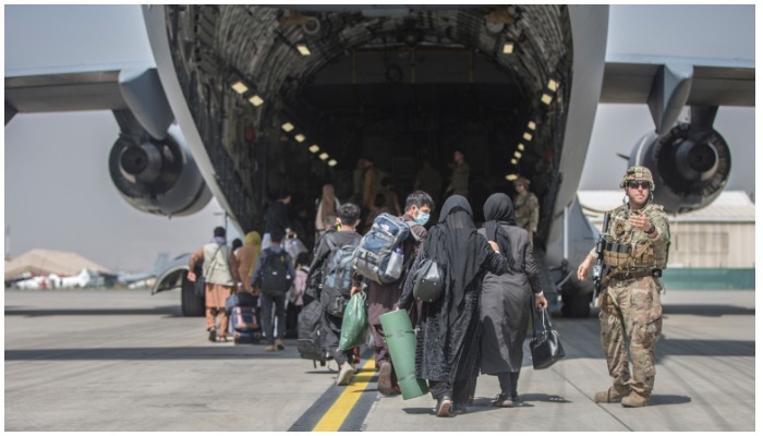 Families boarding a U.S. Air Force Boeing C-17 Globemaster III during an evacuation at Hamid Karzai International Airport in Kabul, Monday, August 23, 2021. Photo AP