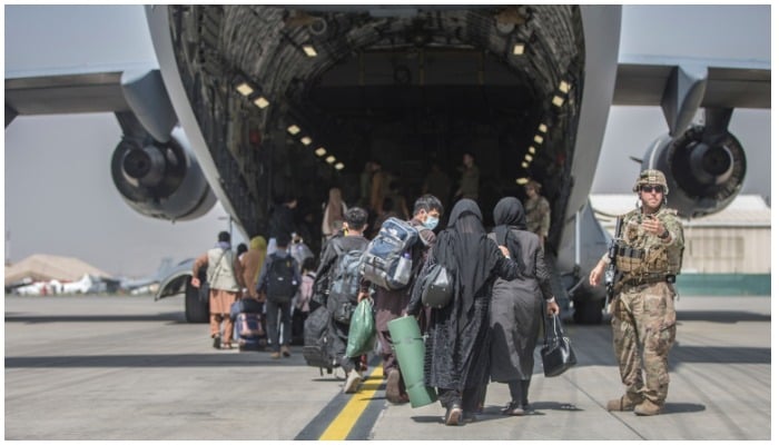 Families boarding a U.S. Air Force Boeing C-17 Globemaster III during an evacuation at Hamid Karzai International Airport in Kabul, Monday, August 23, 2021. Photo AP