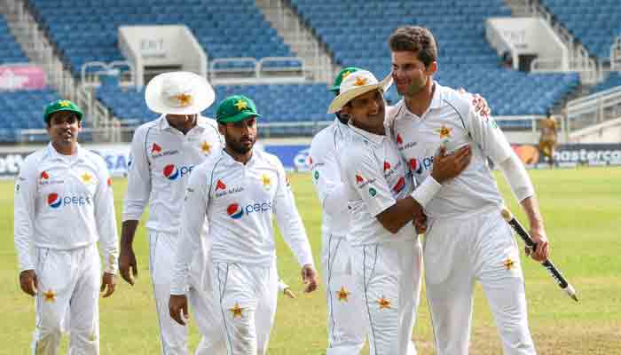 Shaheen Afridi (R) and Nauman Ali (2R) of Pakistan celebrate winning the 5th and final day of the 2nd Test between West Indies and Pakistan at Sabina Park, Kingston, Jamaica, on August 24, 2021.-AFP