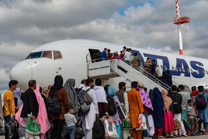 Evacuees from Afghanistan board an Atlas Air aircraft for a departure flight on their way to the United States as part of Operations Allies Refuge, at Ramstein Air Base, Germany, August 24, 2021. U.S. Air Force/Airman Edgar Grimaldo/Handout via REUTERS