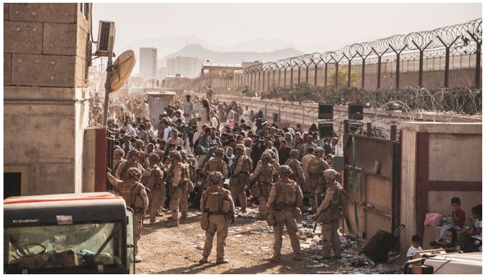 US Marines provide assistance at an Evacuation Control Checkpoint during an evacuation at Hamid Karzai International Airport, Afghanistan, on August 22, 2021. Photo Reuters