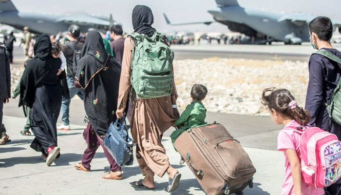 Huge crowds remain outside Kabul airport hoping to flee the threat of reprisals. Photo: AFP