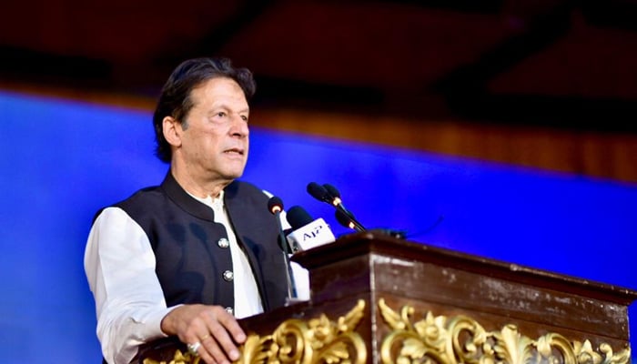 Prime Minister Imran Khan addressing a ceremony at Islamabads Convention Centre to unveil PTIs performance over the last three years, on August 26, 2021. — PID