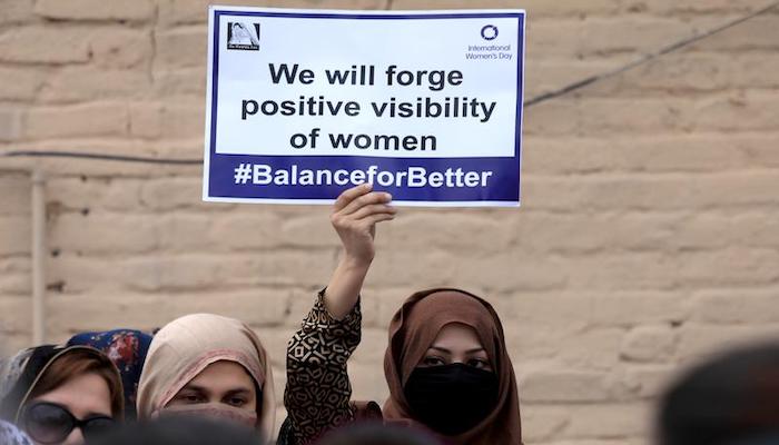 A participant carries a sign during a rally to mark International Womens Day in Peshawar, Pakistan March 8, 2019. Photo: Reuters