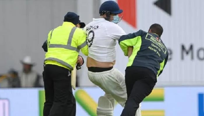 Security escorts pitch invader Jarvo during the third India-England Test match at Headingley, on August 27, 2021. — Twitter