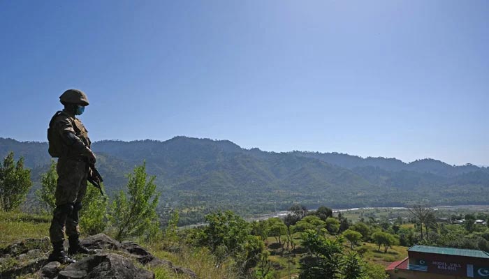 A Pakistani soldier stands guard near the Line of Control, de facto border between India and Pakistan at Salohi village in Poonch district of Azad Jammu and Kashmir on April 26, 2021. &mdash; AFP/File