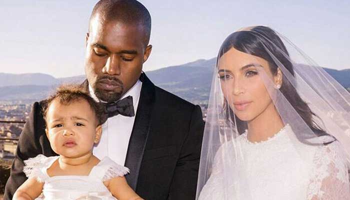 Kim Kardashian shares stunning photos with Kanye West in wedding gown