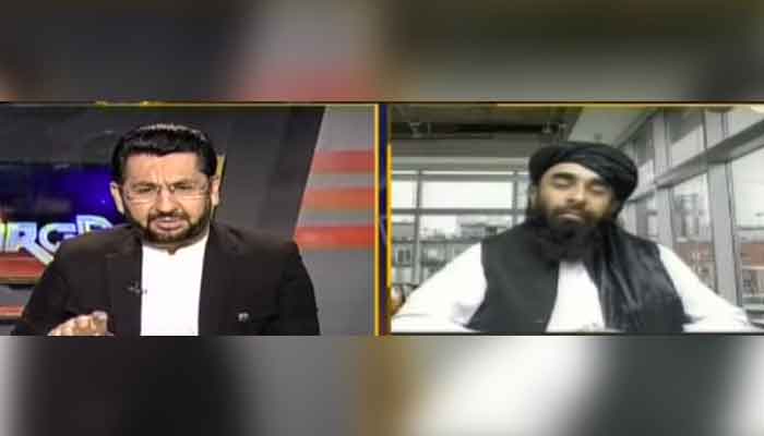 Geo News journalist Saleem Safi hosting programme Jirga (L) and Taliban spokesman Zabihullah Mujahid, during an interview, aired on August 28, 2021. — Geo News