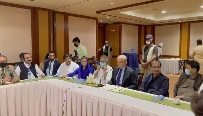 Leader of the Opposition in the National Assembly Shahbaz Sharif (person with the mic) speaks speaking to representatives of media organisations, on August 30, 2021. — Twitter/pmln_org