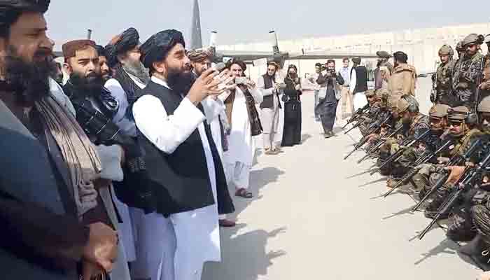 Taliban spokesman Zabihullah Mujahid speaks to Badri 313 military unit at Kabuls airport, Afghanistan August 31, 2021 in this still image obtained from a handout video. -REUTERS