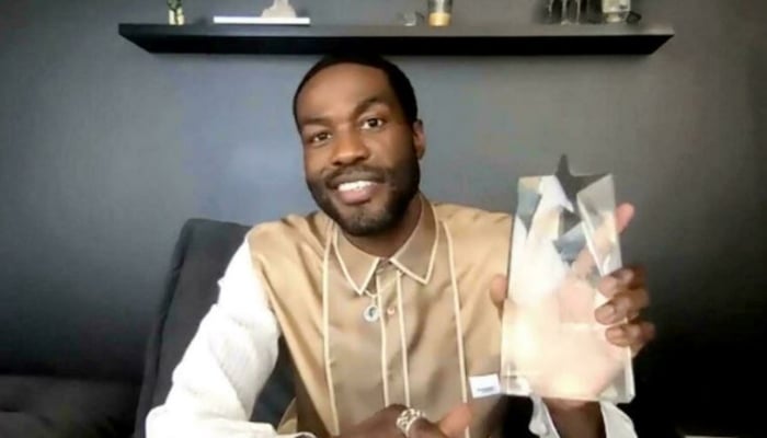 In this screengrab, Yahya Abdul-Mateen II accepts a Critics Choice award on February 2, 2021; he stars in box-office topping slasher film Candyman. Photo: AFP