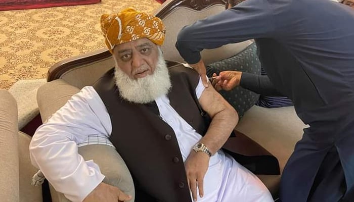 Chief of the Jamiat Ulema-e-Islam-Fazl (JUI-F), Maulana Fazlur Rehman, seen receiving a jab, in photo shared by Jamiar Ulema-e-Islam Pakistan, on August 31, 2021.