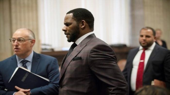 Woman testifies about R. Kelly prodding her to be intimate with him