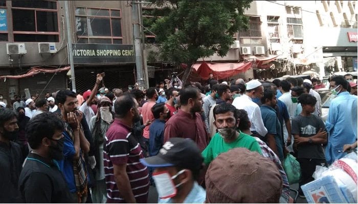 Shopkeepers seen protesting the closure of their shops outside Zainab Markets, on Abdullah Haroon Road, Karachi. Photo: File