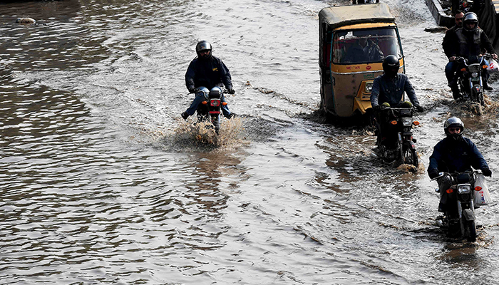 Commuters struggle due to heavy rainfall in Karachi — AFP