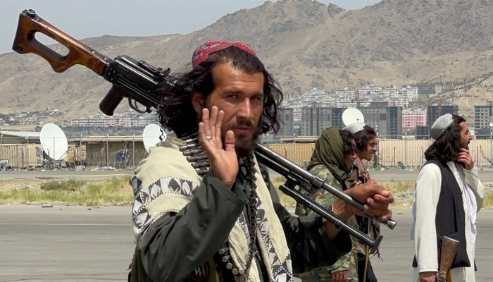 Taliban forces patrol at Kabul airports runway. — Reuters