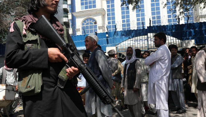 A Taliban security member holding a rifle ensures order in front of Azizi Bank in Kabul, Afghanistan, September 4, 2021.— WANA (West Asia News Agency) via REUTERS