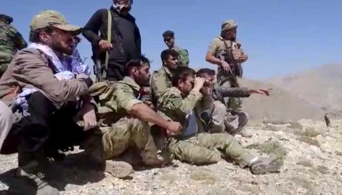 Members of National Resistance Front observe from a hill in Panjshir Valley, Afghanistan in this undated handout picture. — National Resistance Front Of Afghanistan Handout via Reuters