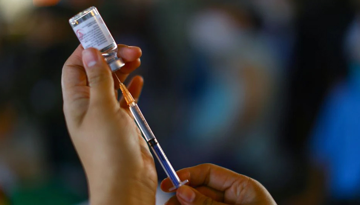 A health worker prepares to vaccinate a school worker with a dose of Chinas CanSino COVID-19 vaccine during a mass vaccination for teachers and school staff against coronavirus disease in Mexico City, Mexico May 18, 2021. — Reuters/File