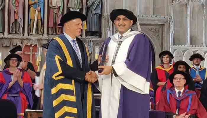 Chaudhry Faisal Mushtaq receiving his degree.