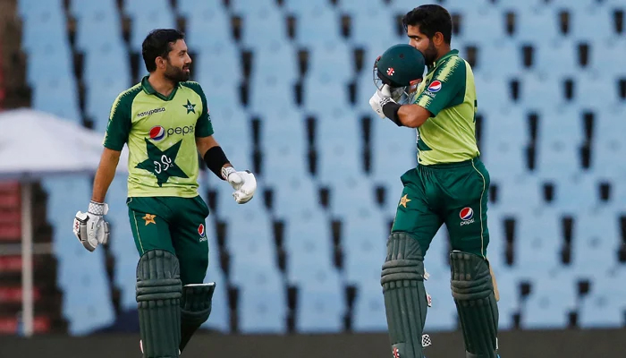 Pakistan´s captain Babar Azam (R) celebrates after scoring a century (100 runs) as Pakistan´s Mohammad Rizwan (L) looks on during the third Twenty20 international cricket match between South Africa and Pakistan at SuperSport Park in Centurion on April 14, 2021. — AFP/File