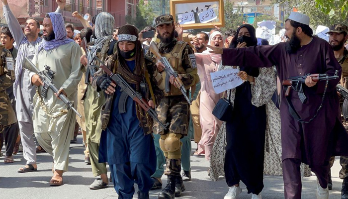 Taliban forces walk in front of Afghan demonstrators as they shout slogans during an anti-Pakistan protest, near the Pakistan embassy in Kabul, Afghanistan, September 7, 2021. — Reuters/File