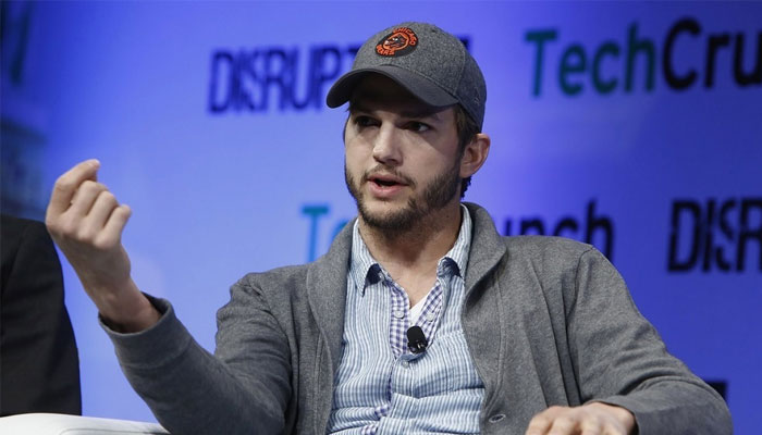 Ashton Kutcher was told by hordes of football fans to “take a shower” as he made an appearance on ESPN