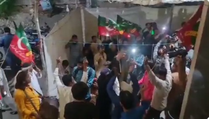 PTI supporters dance to the beat of drums in Karachi after Cantonment Board Election results are announced. Photo: Screengrab from PTI Twitter account