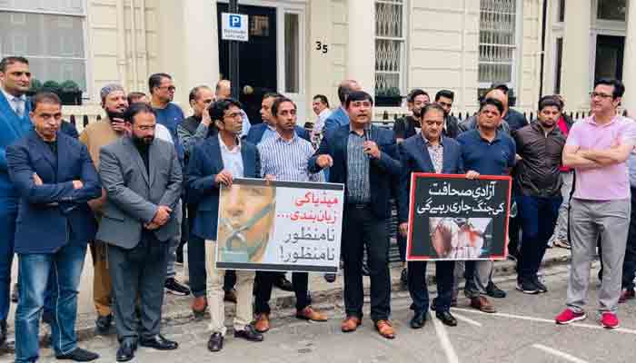 Pakistani journalists holding placards against the establishment of Pakistan Media Development Authority (PMDA) outside Pakistan High Commission in London