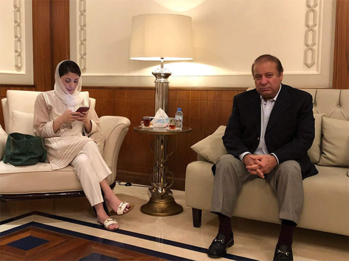 Former prime minister Nawaz Sharif with PML-N Vice President Maryam Nawaz checking her phone. Photo: File